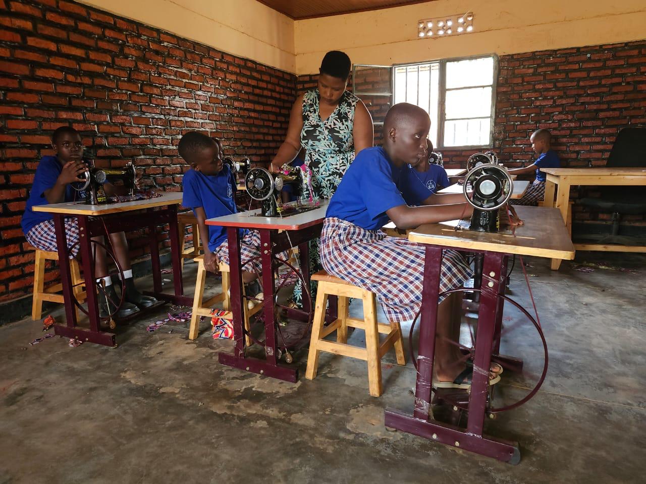 Apprentices training on sewing machines