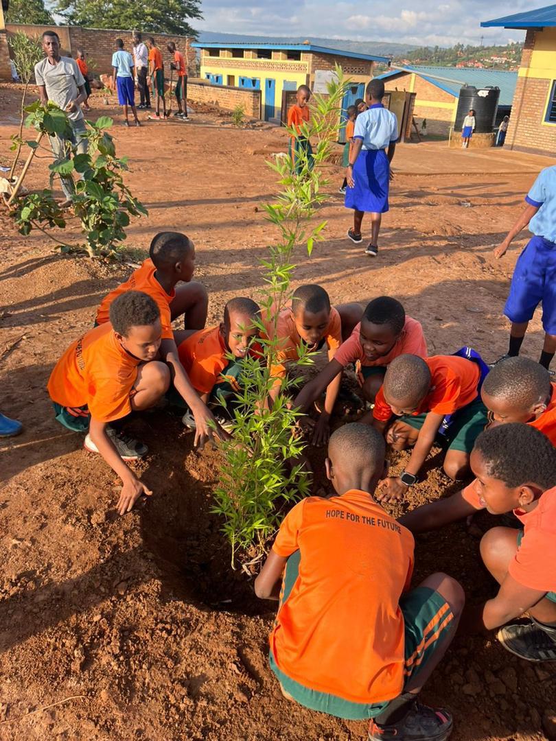 Students planting trees with ASEDC's environment program